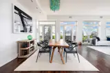 In another corner of the open space is a dining area. There is room for a large table and direct access to the southern terrace.