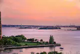 Striking sunset views can be enjoyed from the terrace, which also overlooks the Statue of Liberty and New York City Harbor.