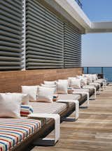 A 55-foot nautical-themed sofa runs along one side of the pool deck.