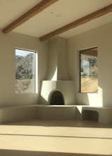 The floor color changes with the mood of the desert throughout the day.  We used Topciment for both the fireplace and the floor.