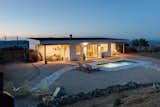 A fire pit, hot tub, and pool provide tons of space to lounge and entertain at Desert Wild.  Photo 1 of 143 in Houses by Tangible Arts LLC from Construction Diary: A Couple Build a Moroccan-Inspired Retreat in Joshua Tree