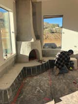 Mike’s crew works on the Georgia O’Keeffe-inspired adobe fireplace.