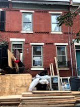 Before: a look at the front red-brick facade prior to the renovation.  Photo 2 of 20 in Before & After: A Resuscitated Row House in Philadelphia Seeks $825K