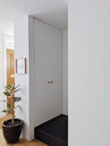 Steps away from the front door is a hidden shoe closet.
