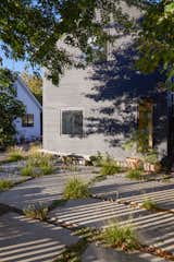 San Francisco–based landscape design studio TALC helped reimagine the lot and the green spaces around the two buildings, with distinct exterior rooms: a meadow, a dining area, a fire pit area, and a patio.
