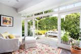 Large French doors open up to the backyard from a reading nook on the first floor. The bright, cozy corner flows onto a granite patio for easy al fresco dining.&nbsp;