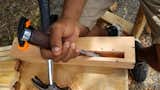 A student chisels a piece of wood in the apprenticeship program.&nbsp;&nbsp;