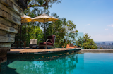 The home's sparkling pool offers yet another tranquil spot to take in the sweeping views. Included in the sale is also the adjacent 1,169-square-foot guest house.
