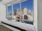 Facing east, windows in the living room and bedroom overlook views of San Francisco. A cozy window seat provides a space to take it all in.