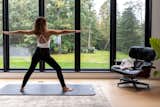 Marvin windows provide a flush exterior and narrow jamb, allowing for slim lines and maximum views in the master bedroom. "I set up my pilates mat and workout there. Even when it’s raining, it’s amazing," says Roula.&nbsp;