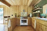 The countertops are Carrara marble and the backsplash tiles are by Heath.