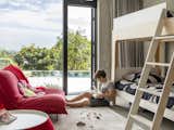 The ground floor, which holds the children’s bedrooms as well as a den and gym, opens to the pool terrace.