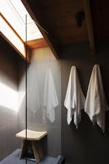 A skylight above the shower illuminates the master bathroom.