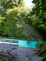 Set on a 6,456-square-foot lot, the home also includes an intimate backyard pool. Thick hedges surround the space, creating an idyllic city escape. 