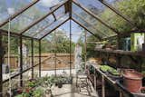 A timber-framed greenhouse completes this unique property.