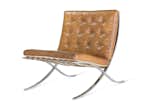 The Barcelona chair was designed by Mies van der Rohe and Lilly Reich for the German Pavilion at the International Exposition of 1929 in Barcelona, Spain. The frame was initially designed to be bolted together, but it was redesigned in 1950 using a seamless piece of stainless steel for a smoother appearance. The ivory-colored pigskin used for the original pieces was eventually replaced with bovine leather.
