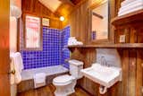 A look at the only full bathroom in the original structure. The space features the original redwood paneling with updated fixtures and finishes.