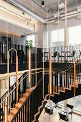 Perhaps the most striking feature, the steel-and-wood staircase mimics architectural qualities found throughout New York city.&nbsp;
