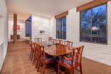 A few steps down is the formal dining room, which easily accommodates a table for eight. Original concrete tile floors run throughout the main living areas.