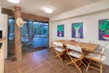 A breakfast area provides direct access to the rear yard via a large sliding glass door.