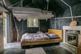 The original, one-room cabin is now the bedroom. A platform lowers from pulleys to provide additional sleeping space.