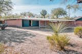 An angular car port juts out and away from the entryway, keeping parked cars cool in the desert heat.  Photo 3 of 16 in This Rare Midcentury Home Will Be Preserved Forever—and Now You Can Spend the Night