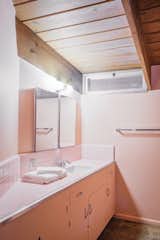 The bathroom is in monochromatic pink—another original color choice.&nbsp;