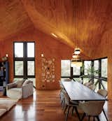 Except for the board-formed concrete stairwell, the interior is clad entirely in pine plywood. “It was a leap of faith to go with the plywood,” says Luciano, “but now we look at it and just think, ‘Wow.’”