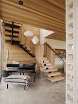A switchback staircase accommodates a grand piano handed down from Anton’s father.