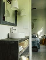 A guest bathroom includes cabinetry built by the couple.