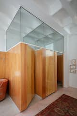 Wood-enclosed "stalls" enhance the usability of the shared space.