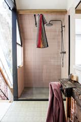 Handmade Portuguese tiles line the floor of the upstairs bathroom, where a MissoniHome towel adds a bright touch.