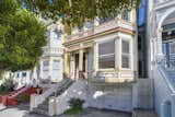 The exterior of this Painted Lady takes on a more muted color palette than its other sisters along the block. Earthy shades of cream, beige, and clay accentuate the home's classic Victorian details.  Photo 3 of 13 in One of San Francisco’s Instantly Recognizable Painted Ladies Lists for $2.75M