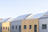 The solar panel–topped roofs vary slightly in height for added visual interest.