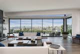 "The lot is in a unique position along Irvine Terrace, an elevated tract community that overlooks the waterfront," says Mike. An expansive wall of sliding glass doors offer unobstructed views.