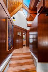 Light hardwoods line the floor of the home's private wing.  Photo 8 of 13 in This Midcentury A-Frame in Denver Offers Serious Storybook Appeal for $865K