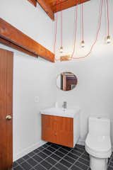 Both bathrooms received a complete, top-down renovation using simple finishes.&nbsp;