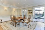 The formal dining room is located right off the kitchen. Two sets of French doors provide direct access to a backyard patio.