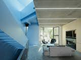 This “Well-Behaved” Home Hides an Ocean of Blue Behind Its Doors