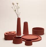 Studio ThusThat, a group of four designers from the Royal College of Art in London, has safely turned "red mud"—an industrial waste from producing aluminum—into a collection of ceramic cups, bowls, and vessels that resemble terra-cotta.