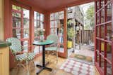 At the back of the kitchen, a small breakfast nook features French doors opening up onto the back patio.