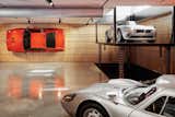 Perhaps the structure’s most impressive feature is a wall-mounted BMW M1 hanging in the basement—a carefully completed job that securely bolted the engineless sports car to the wall. A custom lift carries vehicles between the structure's three levels.