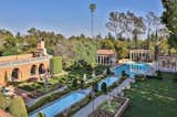 The gardens were designed by landscape architect Paul Thiene, and features a near Olympic-size pool surrounded by smaller fountains. Lush landscaping surrounds the estate.