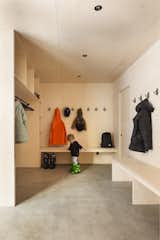 A large mudroom provides a practical space for changing and storing winter gear.