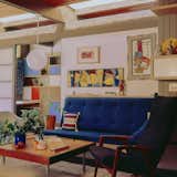 An image from Malinoff’s years in the home reveals an original wall separating the living room from the office.