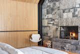 The master bedroom is capped by another stone wall at the end of the structure.