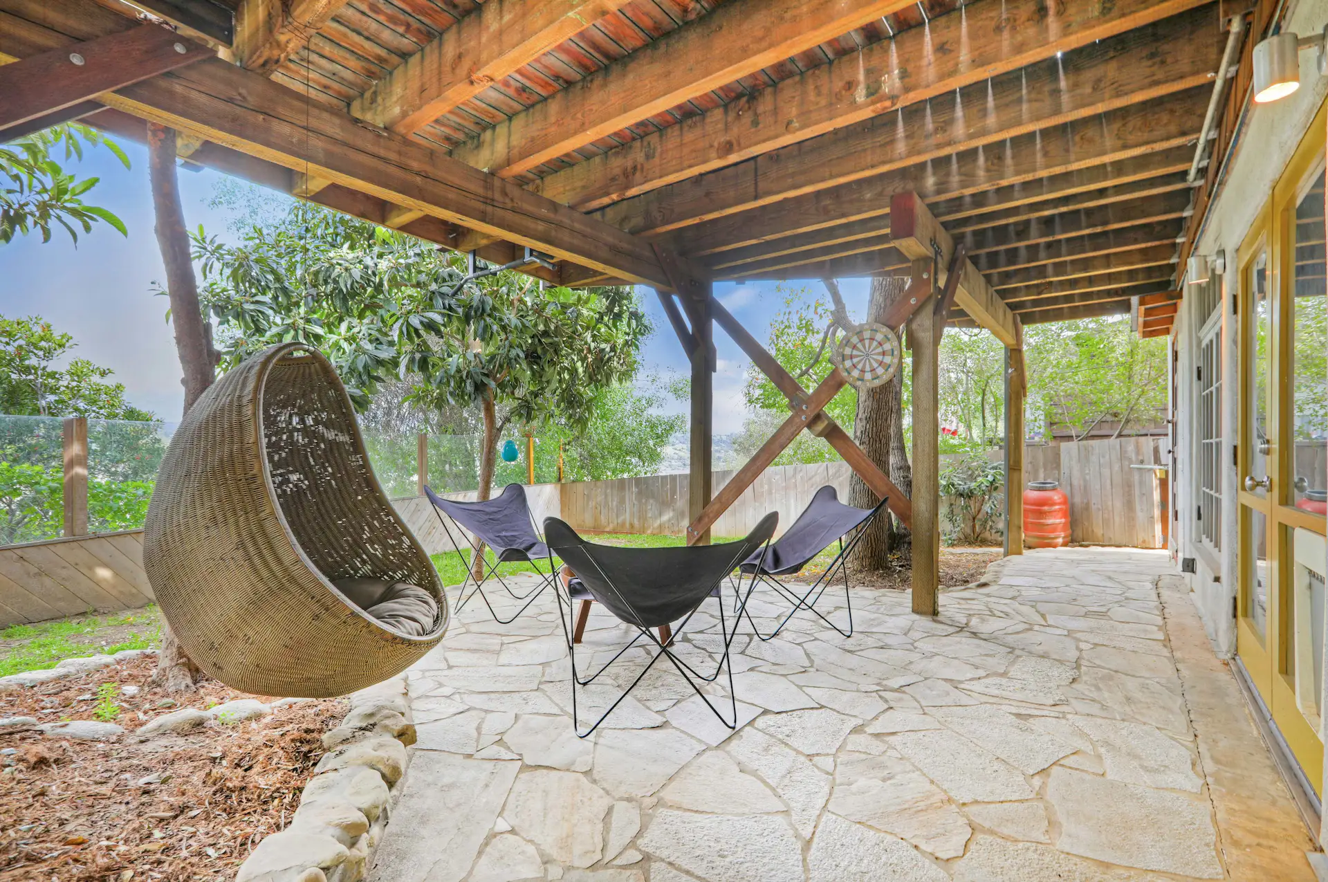 The bonus area opens onto a shaded patio underneath the deck.