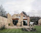 Rather than demolishing the neighboring remains of a 17th-century factory, Will Gamble Architects incorporated the ruins into a Northamptonshire, England, home that blends old and new.