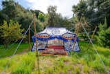 In addition to a raised vegetable garden, the property is also dotted with numerous fruit and olive trees. A colorful, open-air tent provides yet another secluded corner for relaxation.