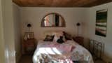 An old chicken coop from down the road was moved and attached to the home to create a bedroom suite.  Photo 12 of 15 in Before & After: A Hudson Valley Farmhouse Masterfully Blends Vintage and Modern